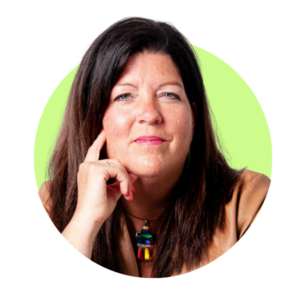 Jennifer Tewathahá:kwa Maracle, Executive Director, Indigenous Initiatives and Reconciliation, is shown holding one hand on her chin in front of a green background.