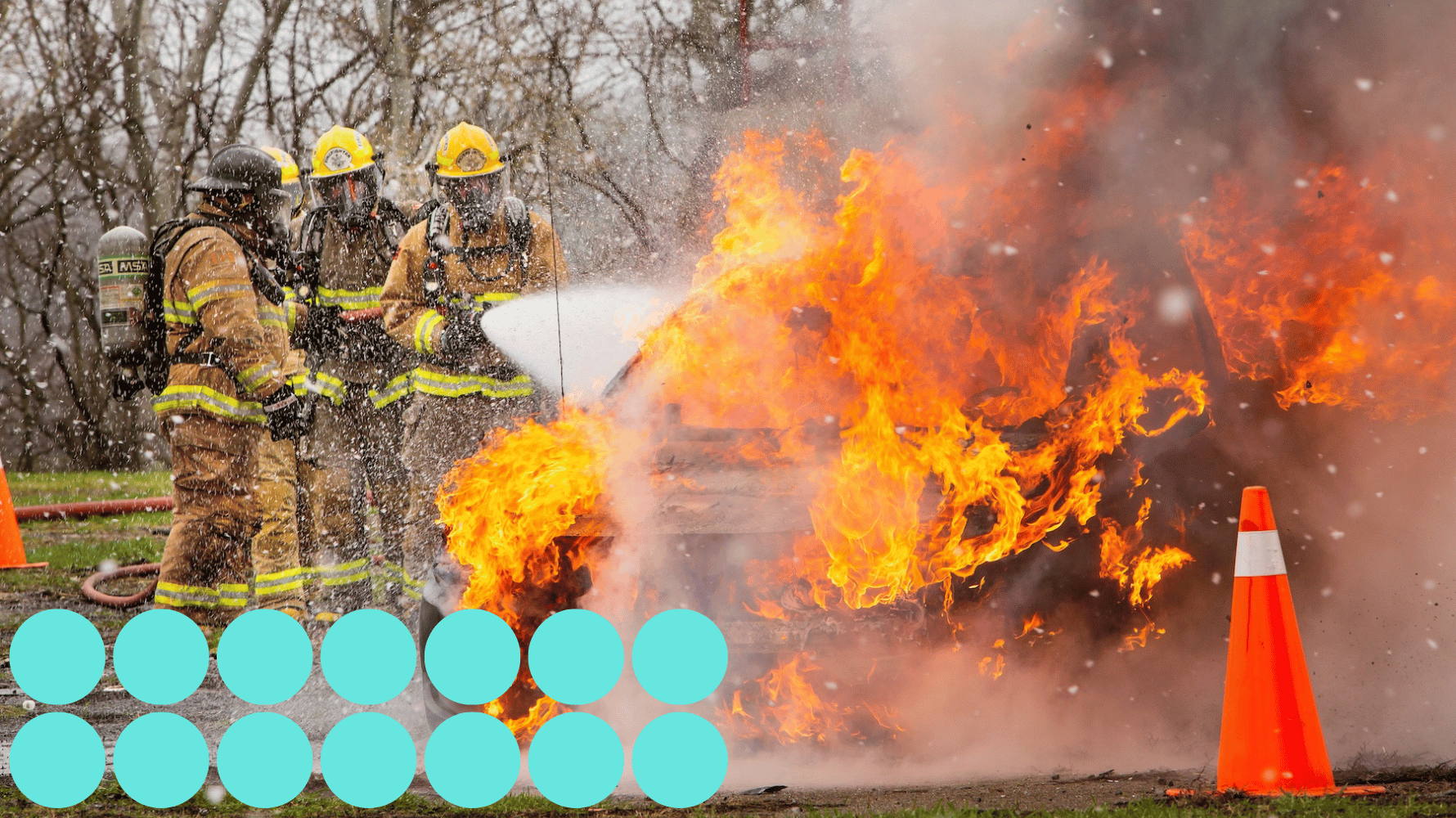 Pre-service firefighter students are holding a hose and wearing firefighter gear working on taking out a fire. Fourteen blue graphic circles are in the lower lefthand corner of the image.