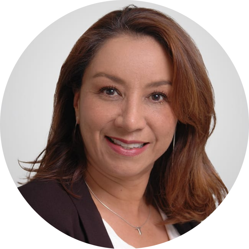 A headshot of Alexandra Perez, Market Specialist. She's smiling and the background is grey.