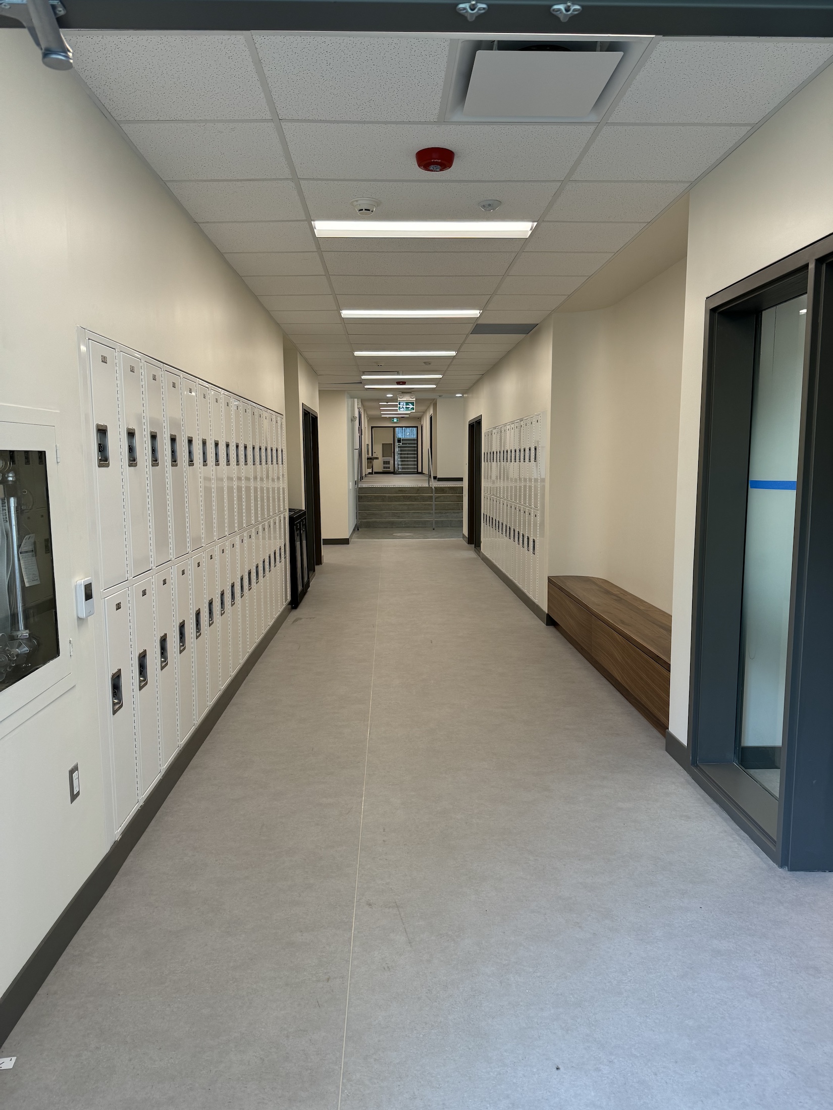 An empty hallway with lockers lining the walls on the second floor of the Port Hope campus.