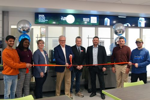 A group of people in the newly opened FailSafe at a ribbon cutting ceremony.