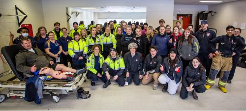 A large group photo of Paramedic and Pre-Service Firefighter students.