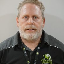 A headshot of Peter Gabriel, Skyhawks Football President, in front of a grey background.