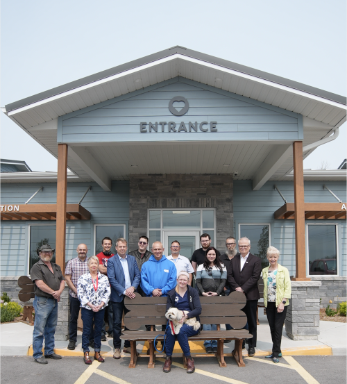 A mixed group of Loyalist students, staff and faculty gathered in front of the Humane Society Hastings Prince Edward.