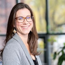 A headshot of Tabatha Bull, President and CEO of the Canadian Council for Aboriginal Business, in front of a blurred indoor background.