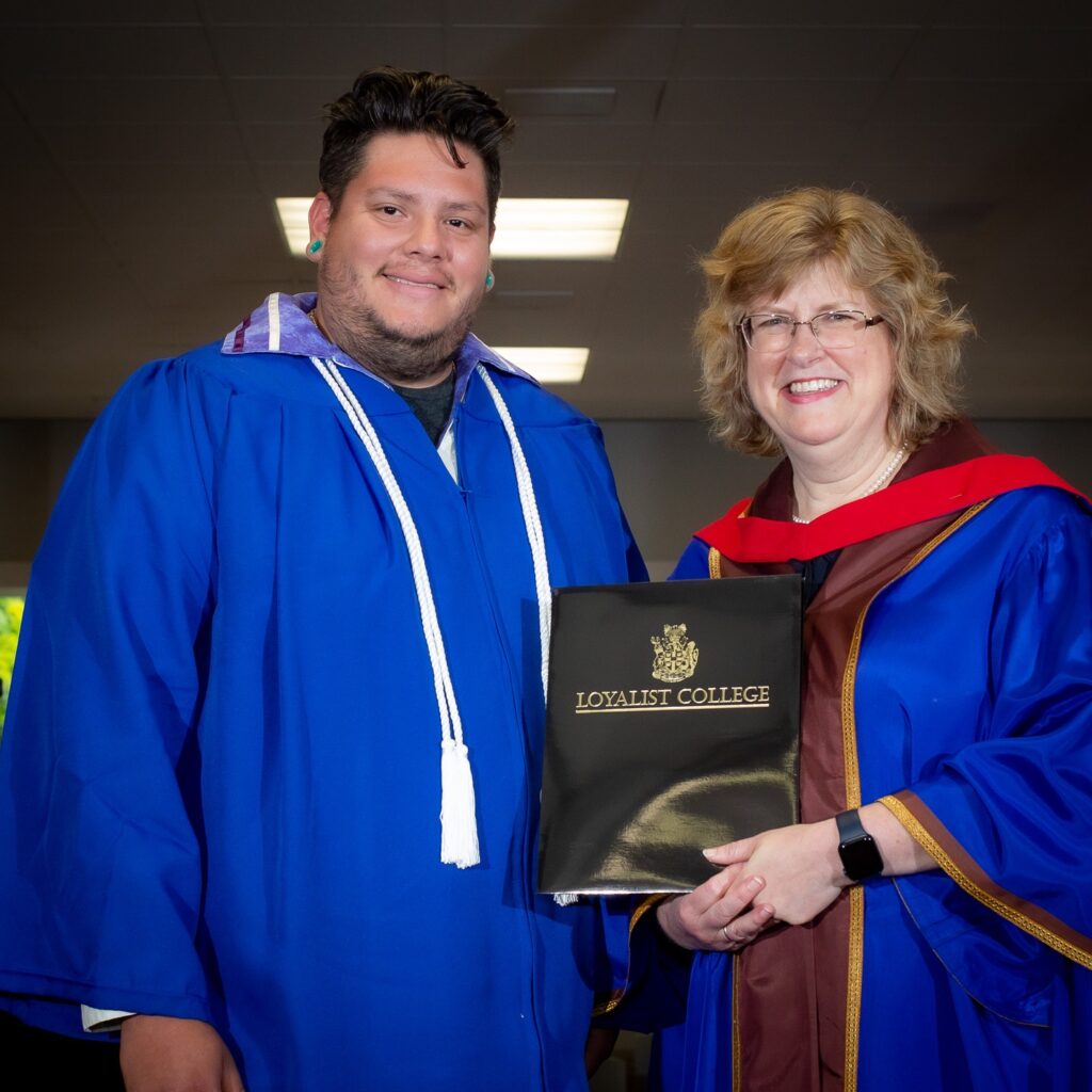 Shandon Maracle receives his diploma from President and CEO of Loyalist College, Ann-Marie Vaughan in 2020