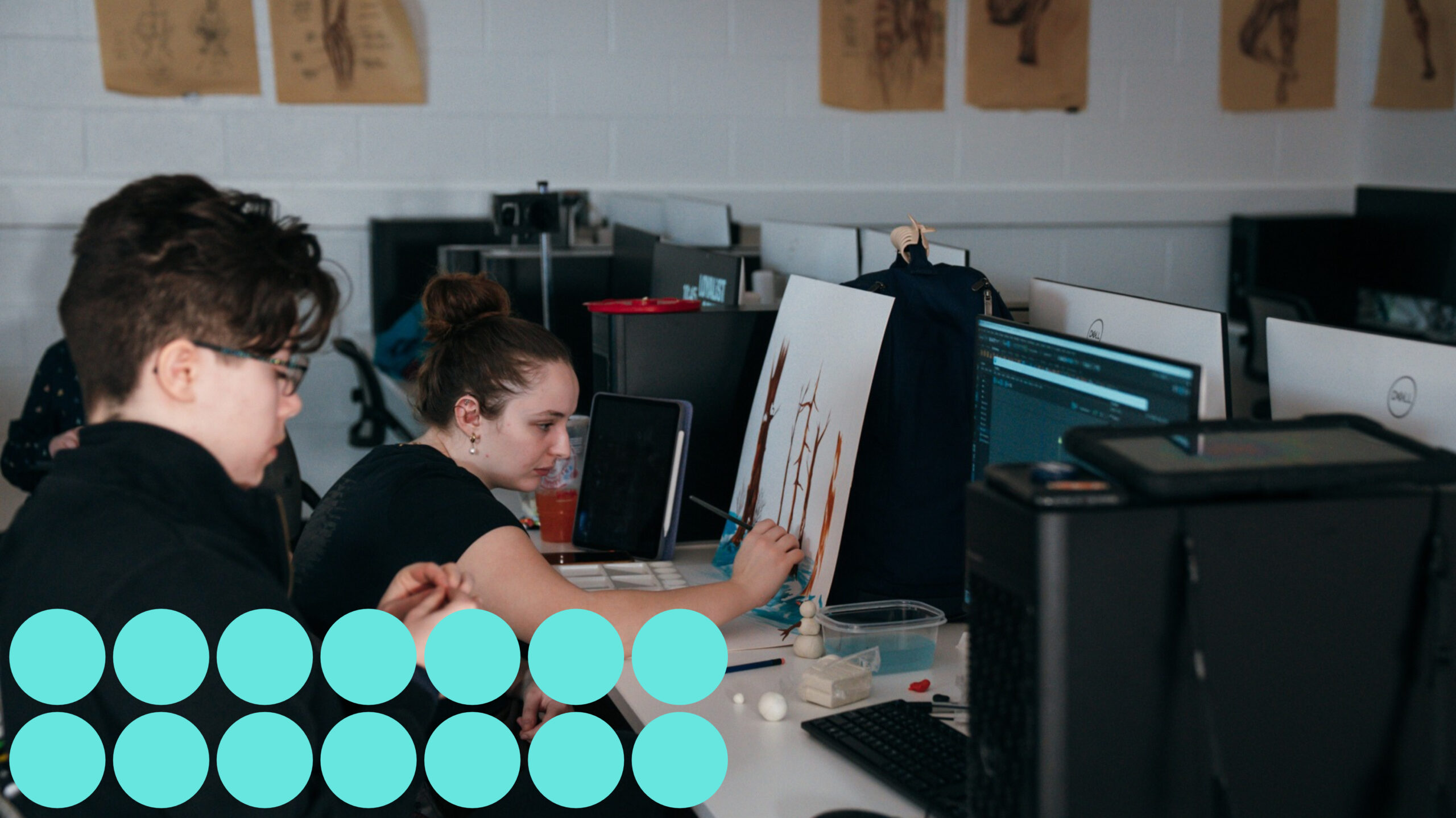 The Art and Design Foundations program student draws on paper