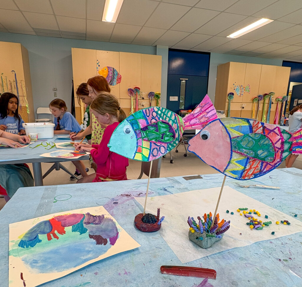 Children participate in hands-on art creation during Loyalist College's summer arts camp.