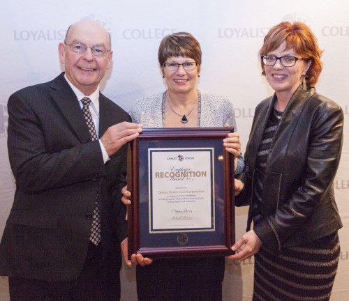 Mary Clare Egberts of Quinte Health Care Corporation is presented with an Employer Recognition Award by Alumni Association President Richard Beare and Loyalist College President and CEO Maureen Piercy