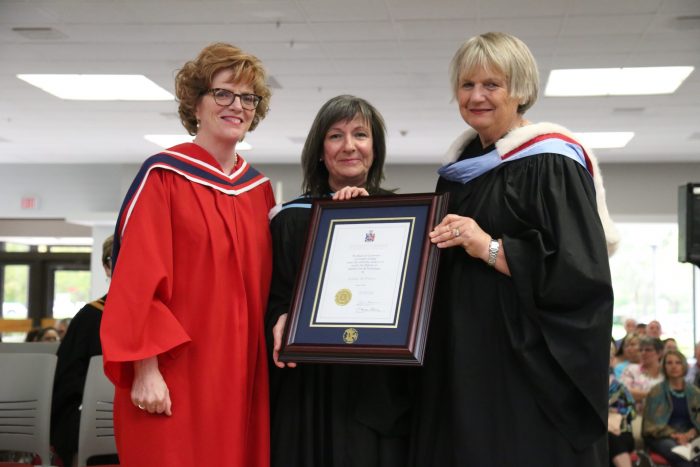Loyalist College President and CEO Maureen Piercy, left, and Loyalist College Board Chair June Hagerman, right, presented guest speaker Ms. Louise St-Pierre, President and Chief Executive Officer of Cogeco Connexion, with an Honorary Diploma, the College’s highest academic tribute