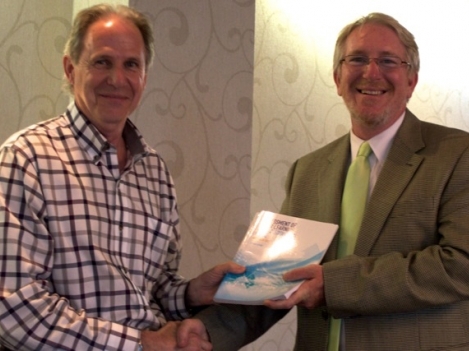 (Left to right) Loyalist Social Service Worker Professor Mark Gallupe presents Ross Danaher, Director, Library & Research Services, Loyalist College, with a copy of the second edition of Assessment of Prior Learning: A Practitioners Guide, a book he co-authored. The publication was officially launched during the 24th Annual PLA Conference hosted by Loyalist May 28th through 31st at the Travelodge in Belleville.