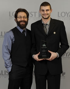 The Bob McKendrick Award was presented to Dustin Mahoney (right), as the individual who contributed the most to campus recreation and outdoor education. The award was presented by Coordinator of Campus Recreation and Fitness Facilities Cory Mestre.