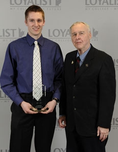 The Bob Young Award for academic and athletic excellence was presented to Jared Moelker (left) by Bob Young. 