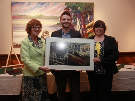 President Maureen Piercy (left) and Chair Tamara Kleinschmidt (right) present retiring Governor David Pickett (centre) with a parting gift during the Board of Governors meeting September 12.