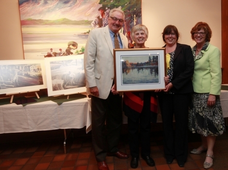 Past Chair Stuart Wright (left), Chair Tamara Kleinschmidt (centre-right) and President Piercy (far right) present retiring Past Chair Margaret Werkhoven (centre-left) with a parting gift during the Board of Governors meeting September 12. 